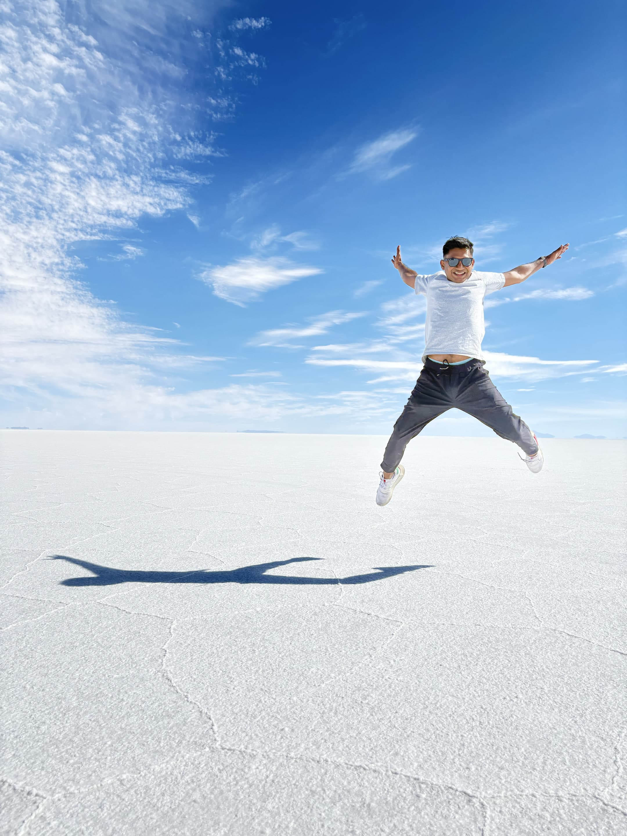 Dollar jumping across the bright expanse of the Uyuni salt flats.