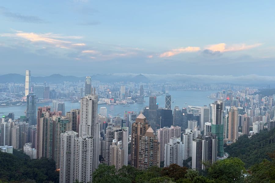 Hong Kong skyline viewed across the harbor in daylight.